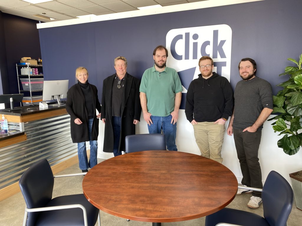 A Click IT store team inside their store