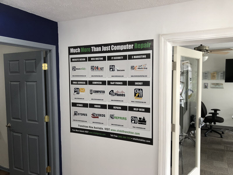 The Click IT services wall sticker inside a Click IT store