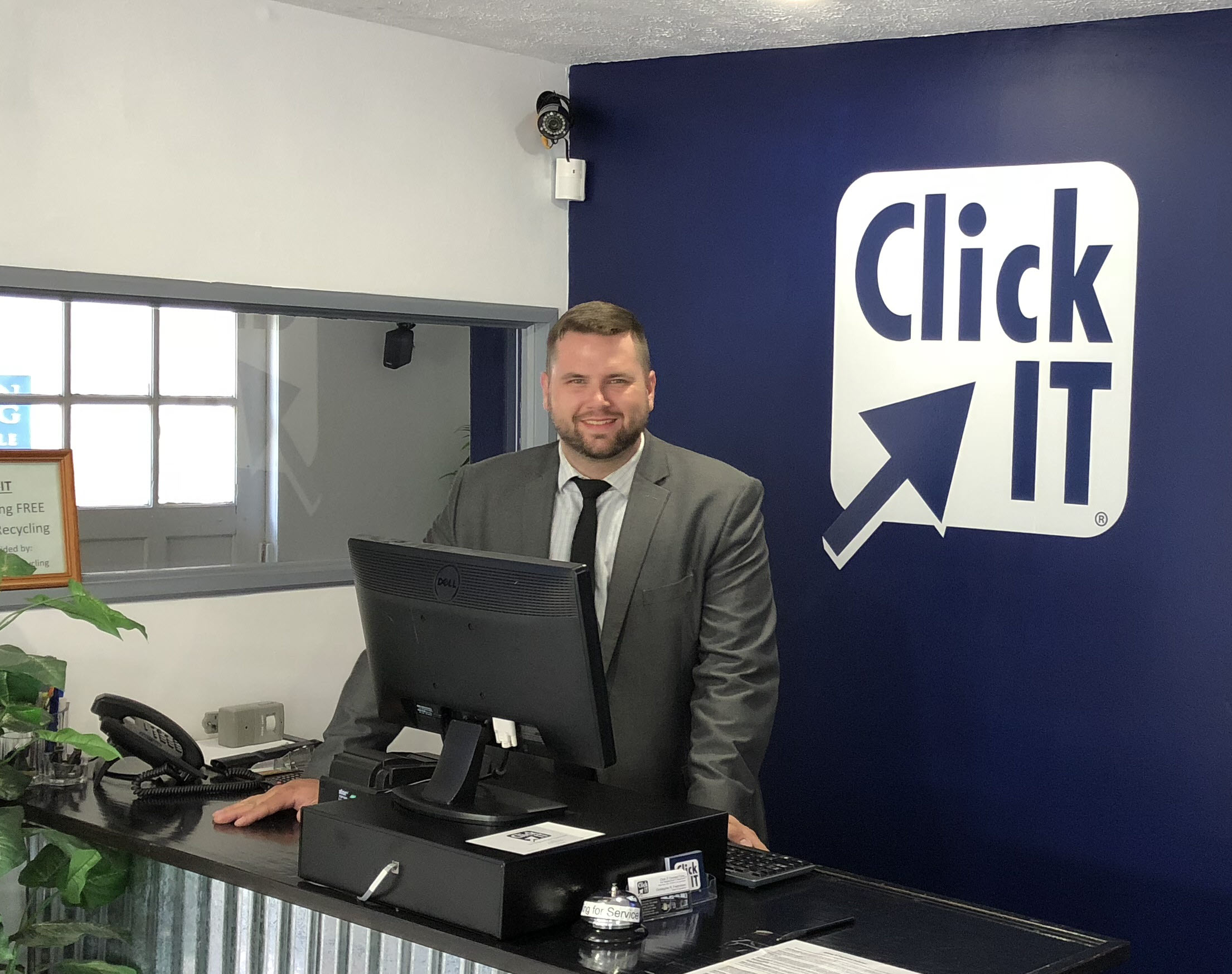 Click IT franchise team member at the front counter